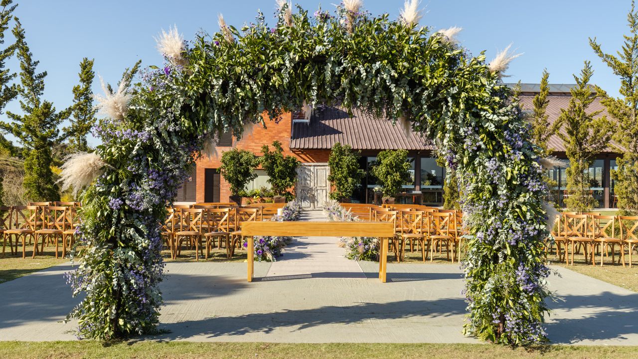 Outdoor ceremony arch with florals